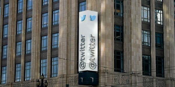 Bedroom made for employees in Twitter office, where everything from washing machine to slippers